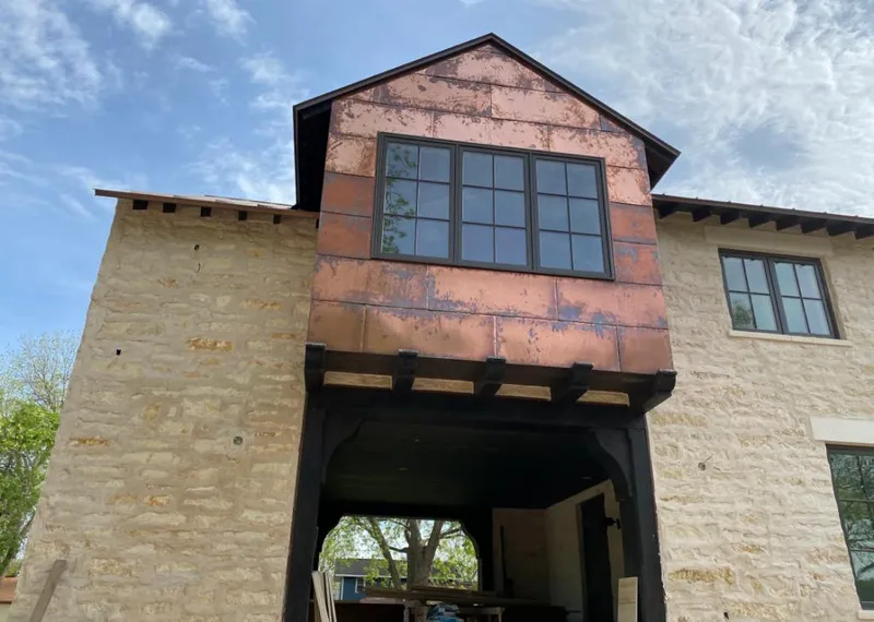 Copper metal panel facade on a stone building for Skylight Installation in Long Branch
